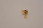 Vintage gold-toned dolphin rhinestone lapel pin
