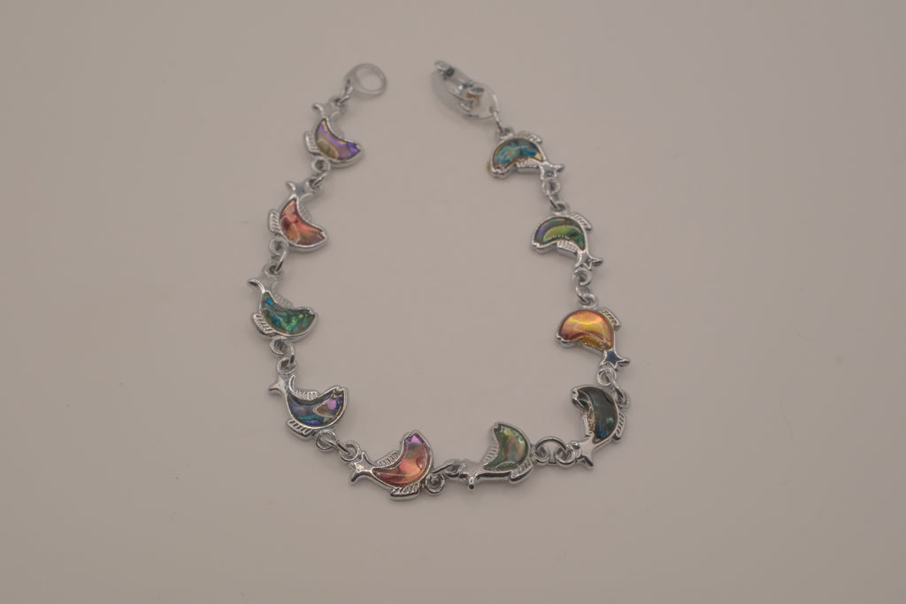 Silver-tone abalone dolphin as crescent motifs link bracelet