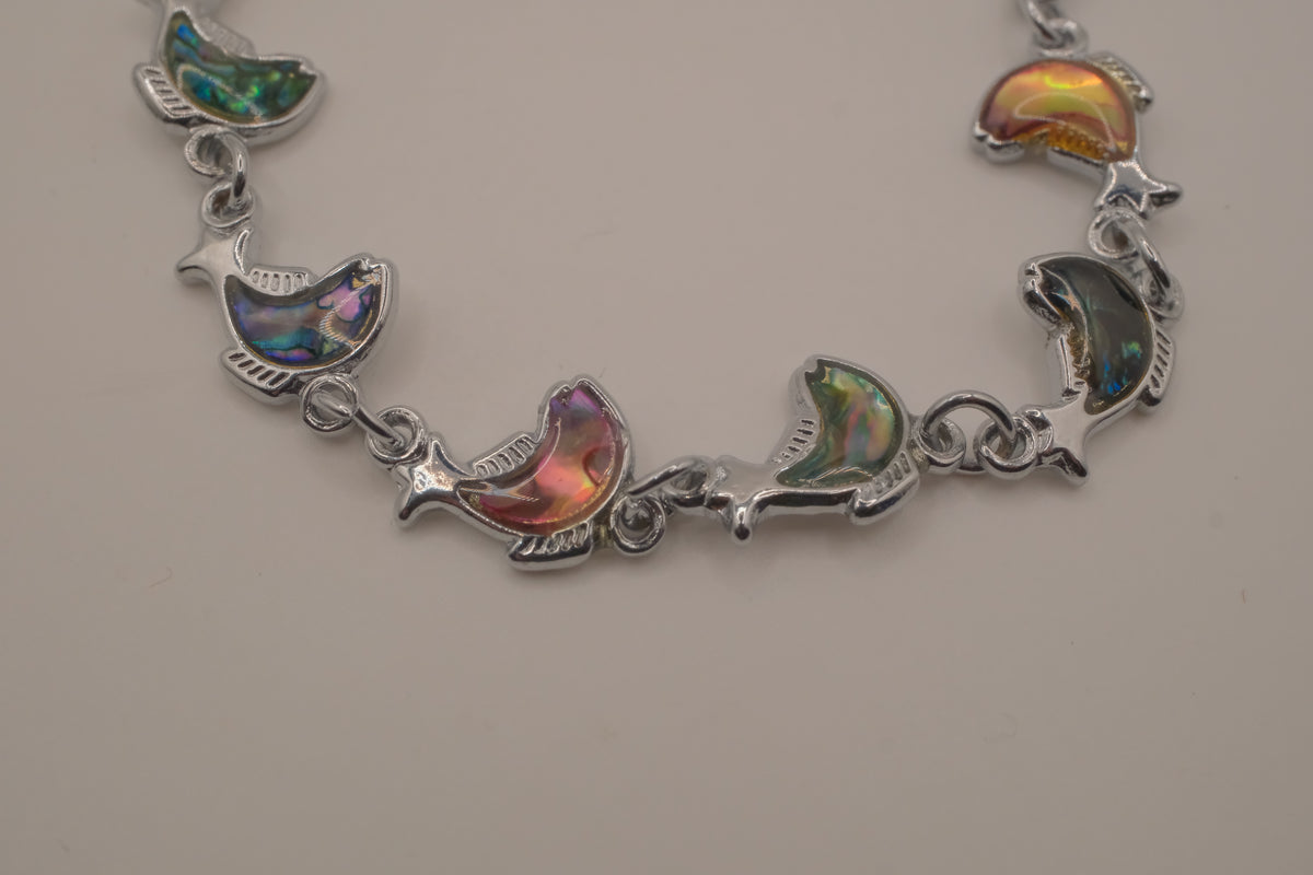 Silver-tone abalone dolphin as crescent motifs link bracelet