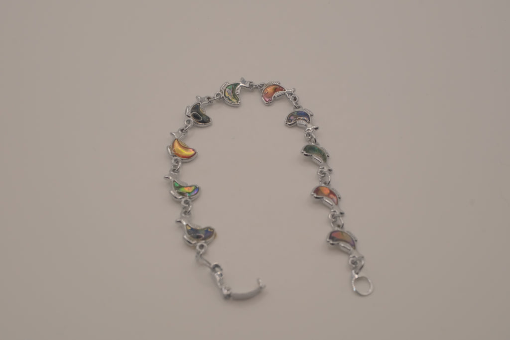 Silver-tone abalone dolphin as crescent motifs link bracelet