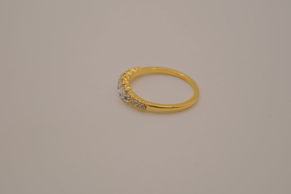 Gold tone prong-set oval clear stones ring