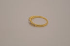 Gold tone prong-set oval clear stones ring