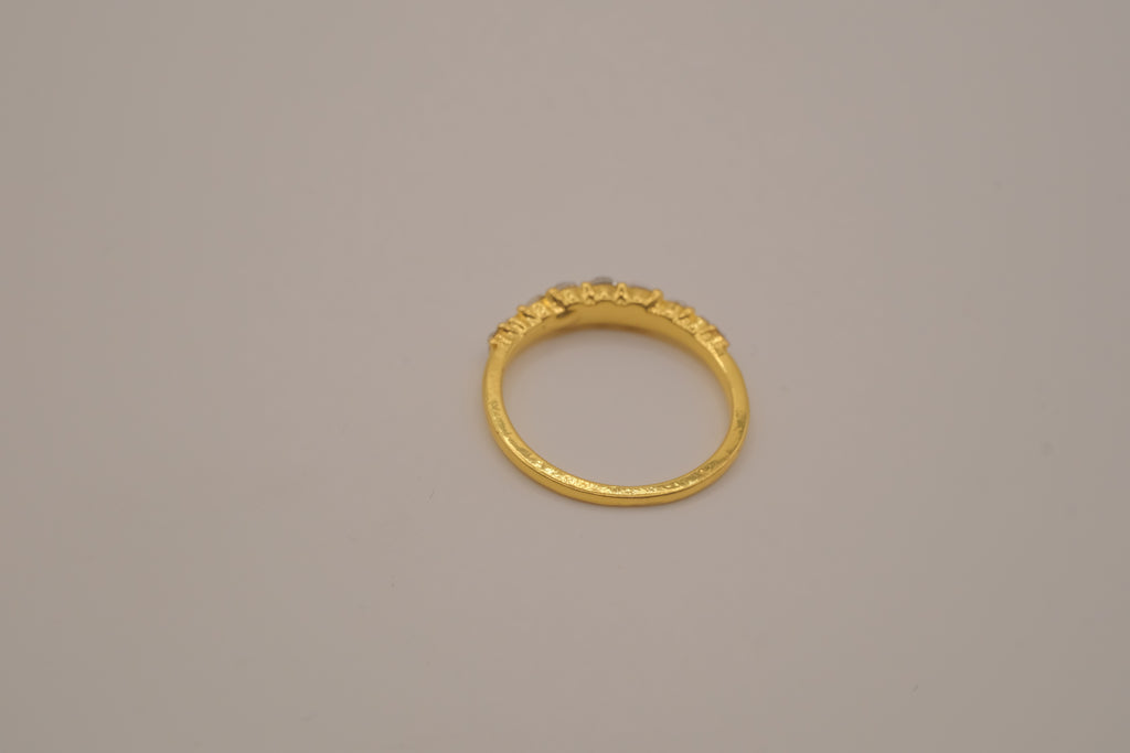 Gold tone prong-set oval clear stones ring