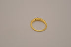 Gold tone prong-set oval clear stones ring