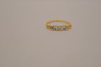 Gold tone prong-set oval clear stones ring