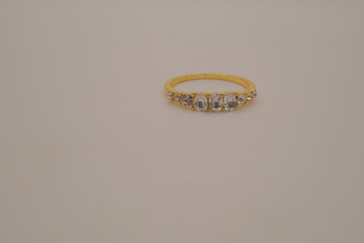 Gold tone prong-set oval clear stones ring