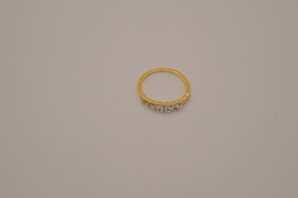 Gold tone prong-set oval clear stones ring