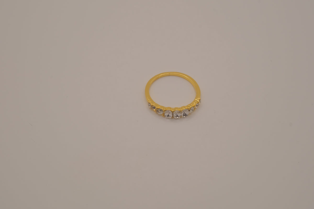 Gold tone prong-set oval clear stones ring