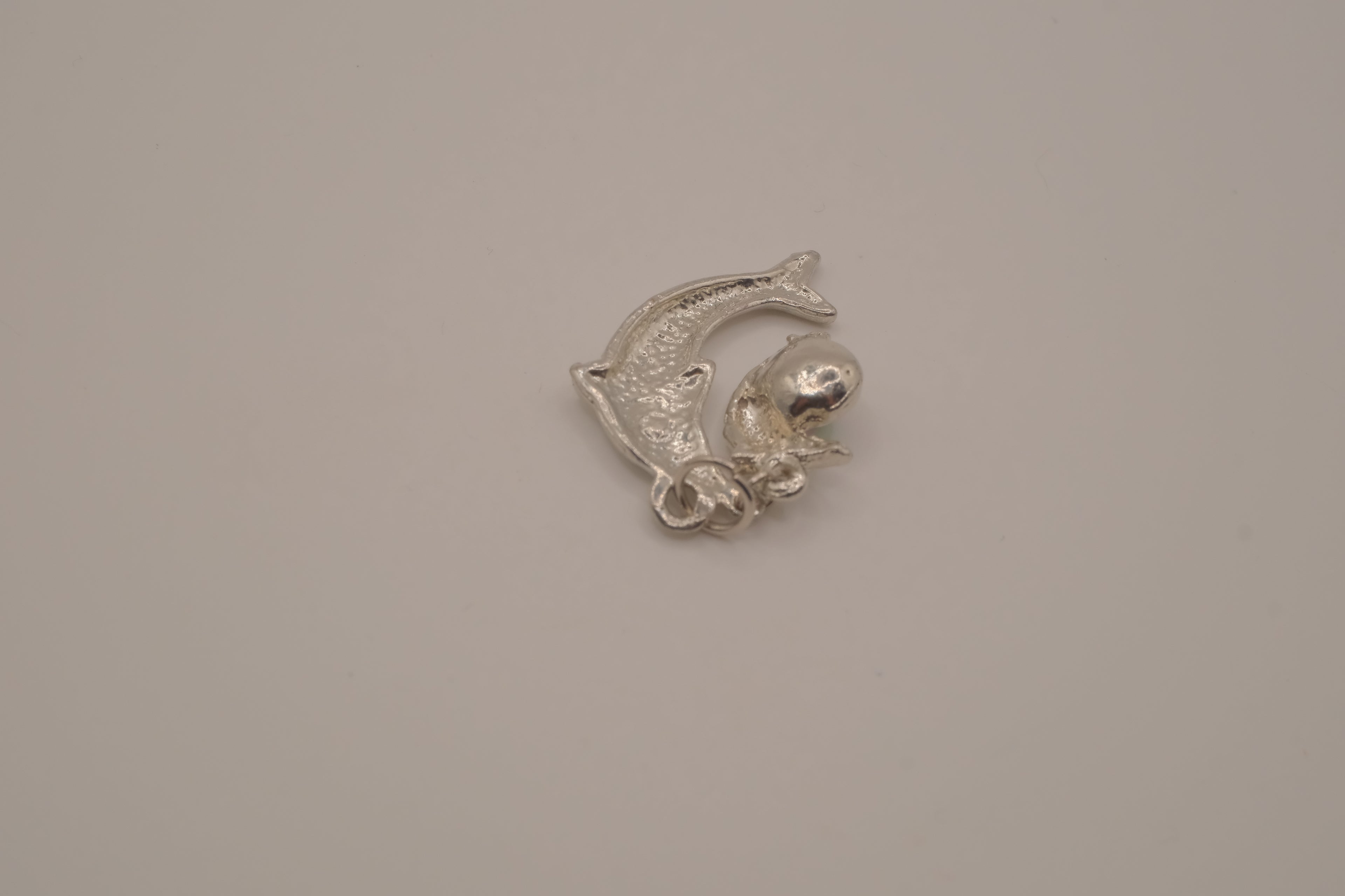 Silver tone Double dolphin pendant