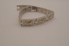 Two-tone dolphin design link bracelet