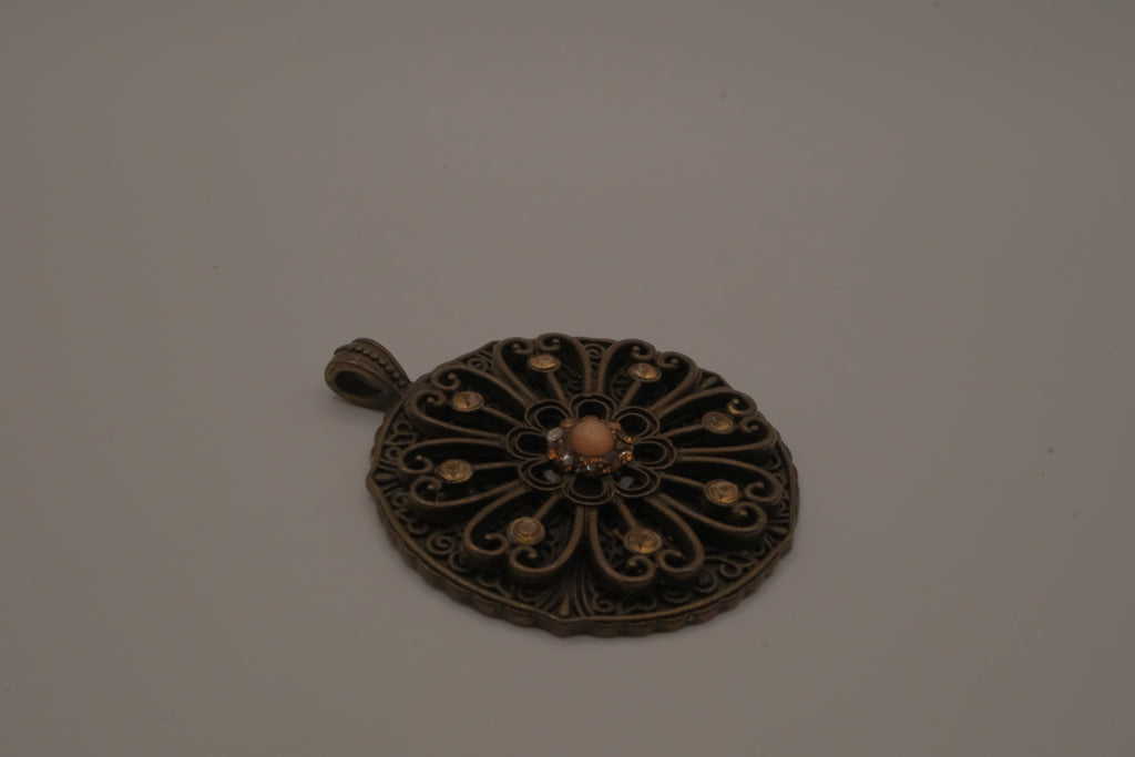 Vintage bronze-tone openwork filigree medallion pendant