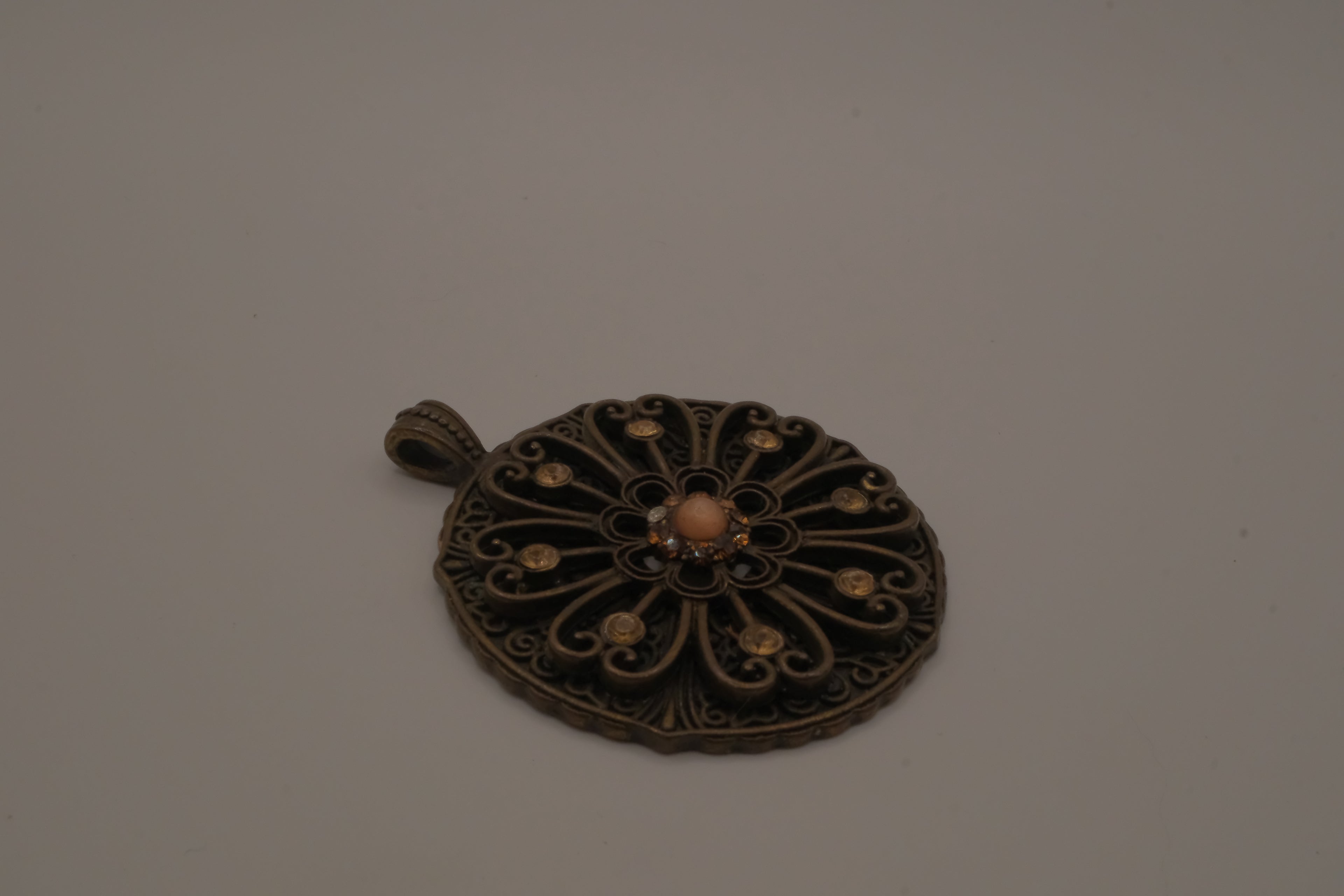 Vintage bronze-tone openwork filigree medallion pendant