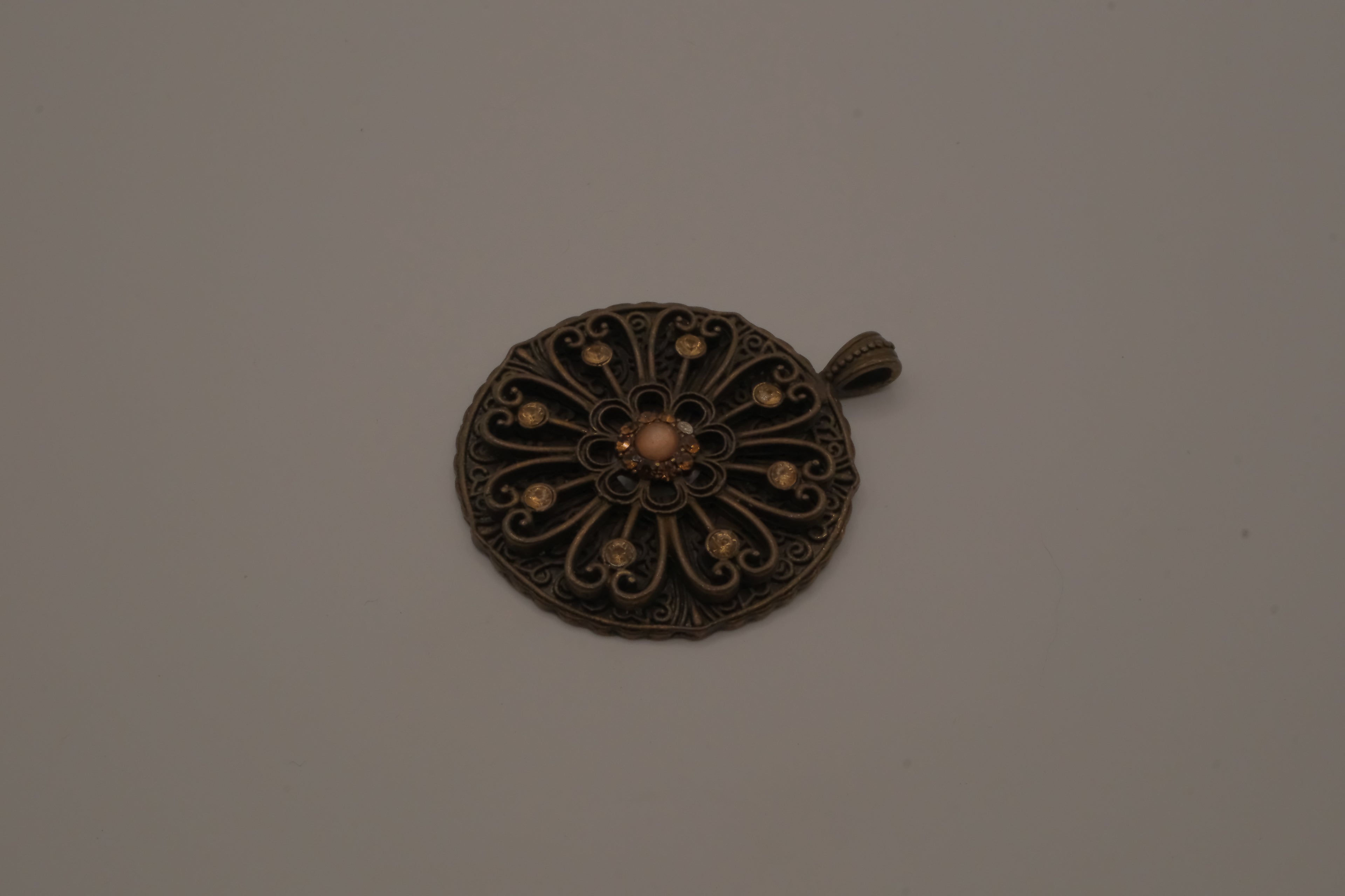 Vintage bronze-tone openwork filigree medallion pendant