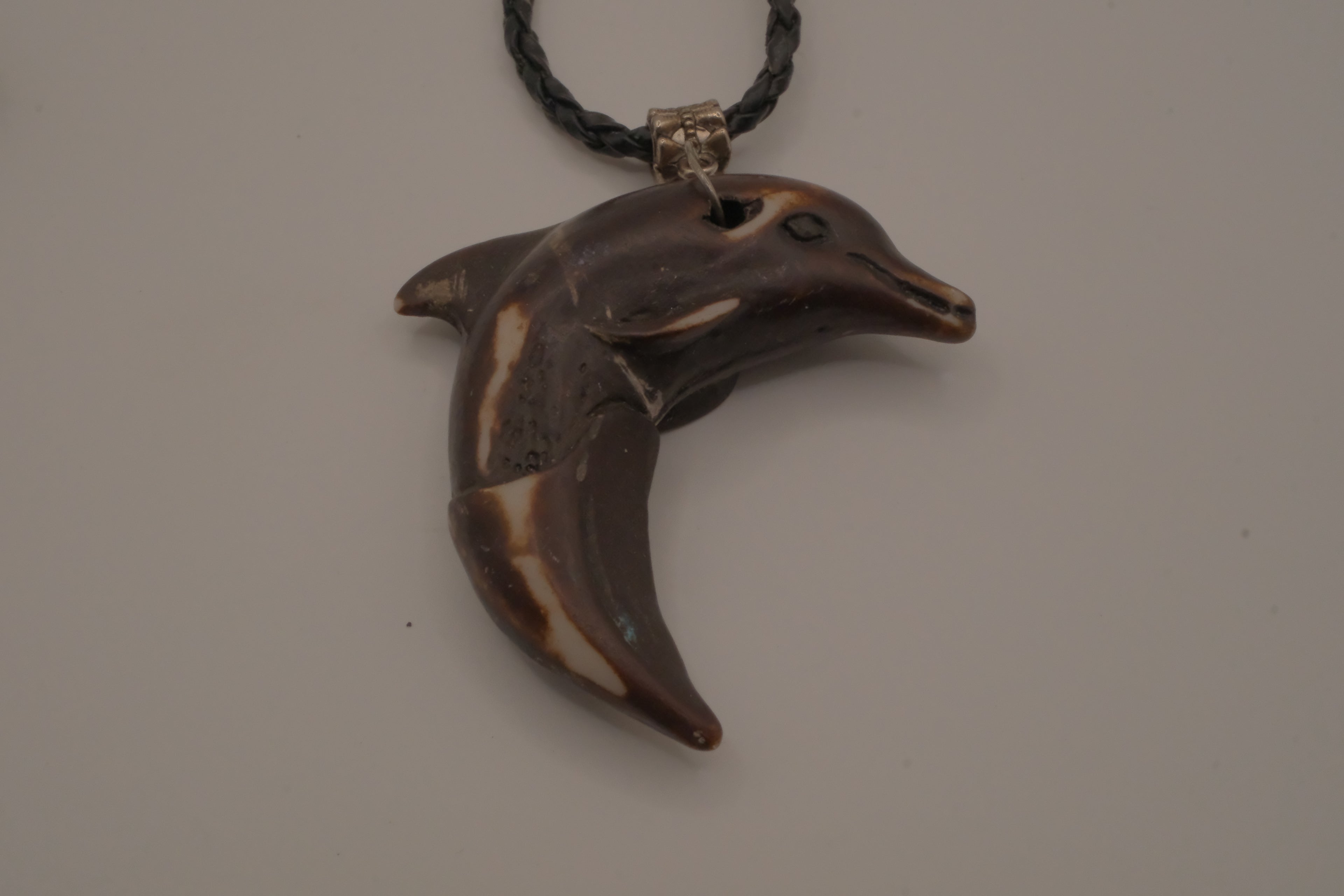 Hand-carved wooden dolphin pendant necklace