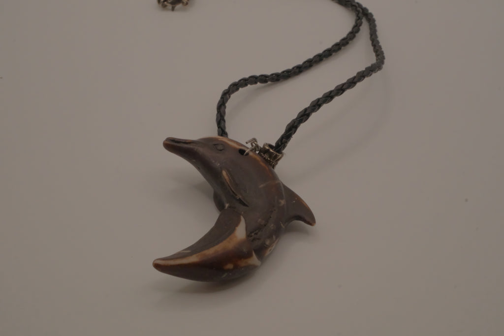 Hand-carved wooden dolphin pendant necklace