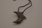 Hand-carved wooden dolphin pendant necklace
