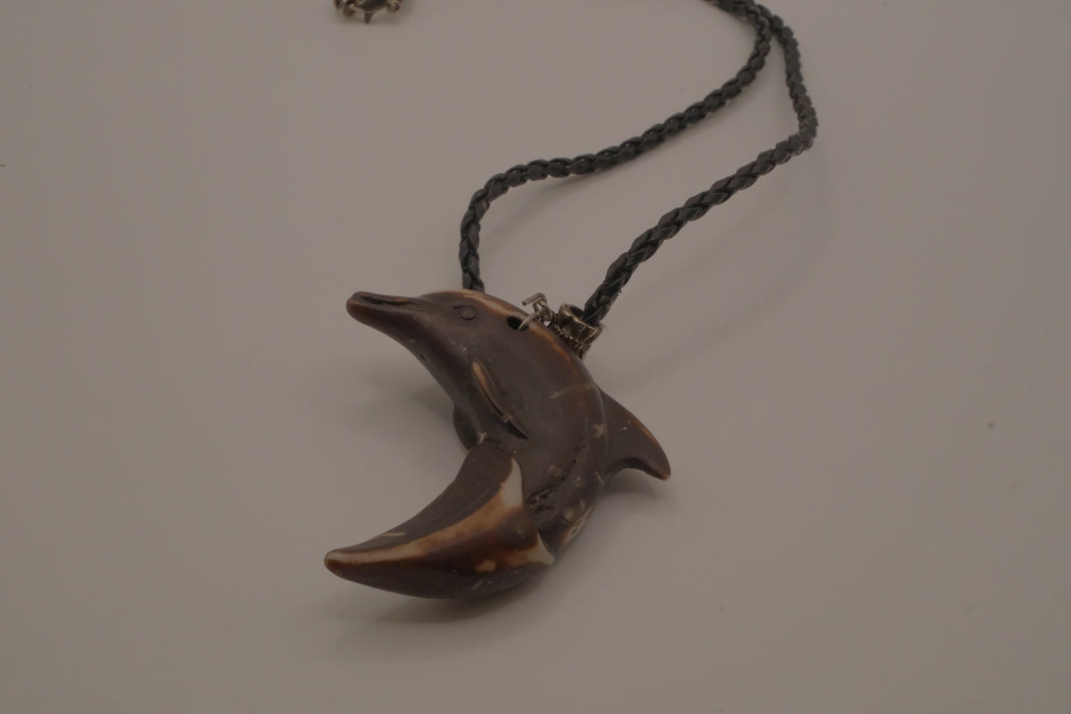 Hand-carved wooden dolphin pendant necklace