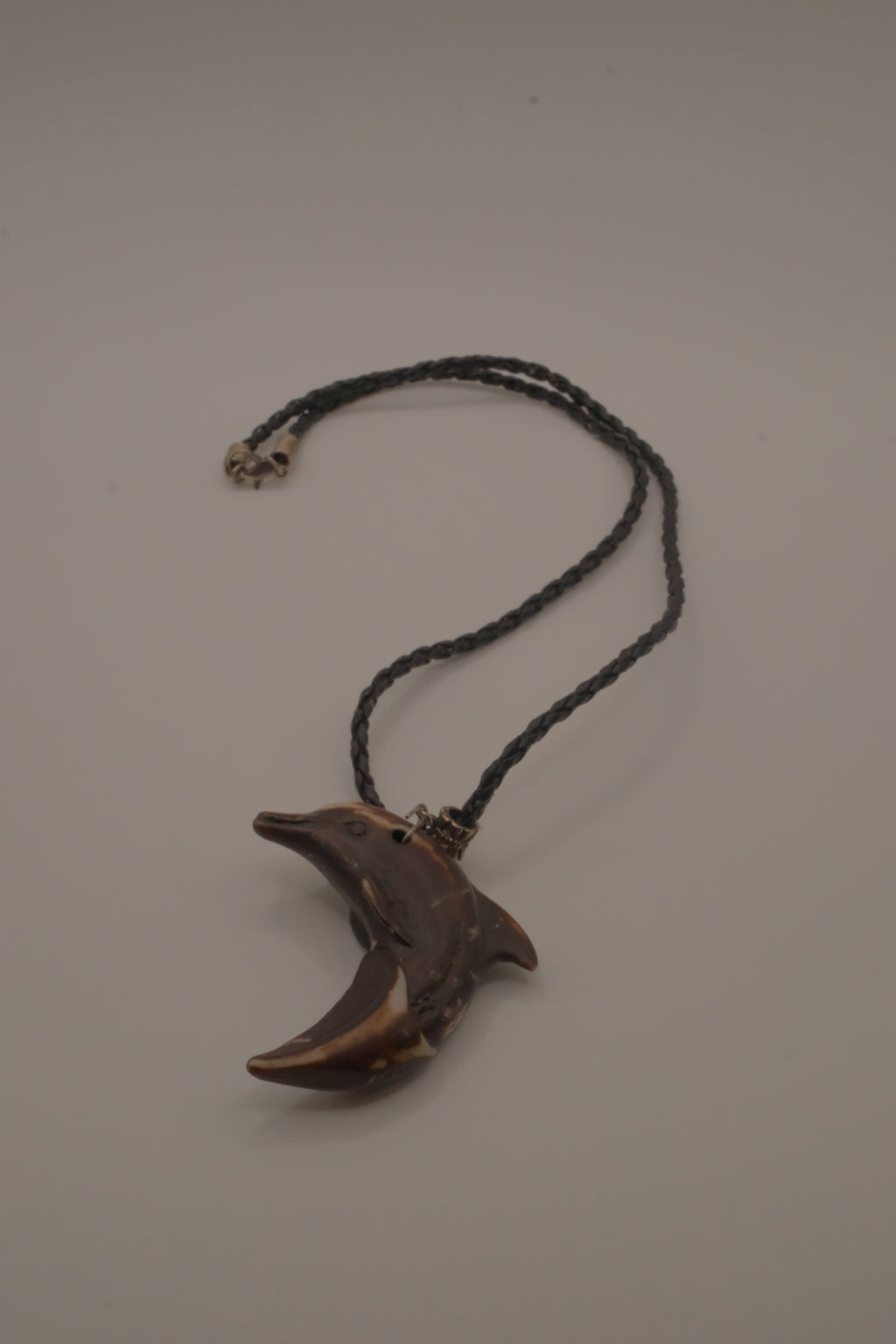 Hand-carved wooden dolphin pendant necklace