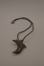 Hand-carved wooden dolphin pendant necklace