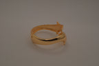 Gold tone two interlocking dolphins cuff bracelet