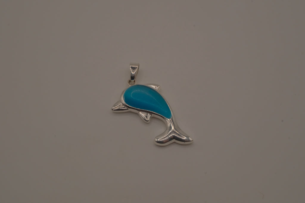 Dolphin pendant inlaid with a blue cabochon