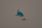 Dolphin pendant inlaid with a blue cabochon