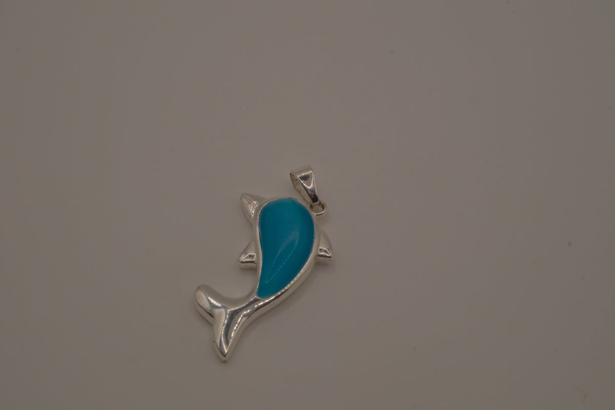 Dolphin pendant inlaid with a blue cabochon