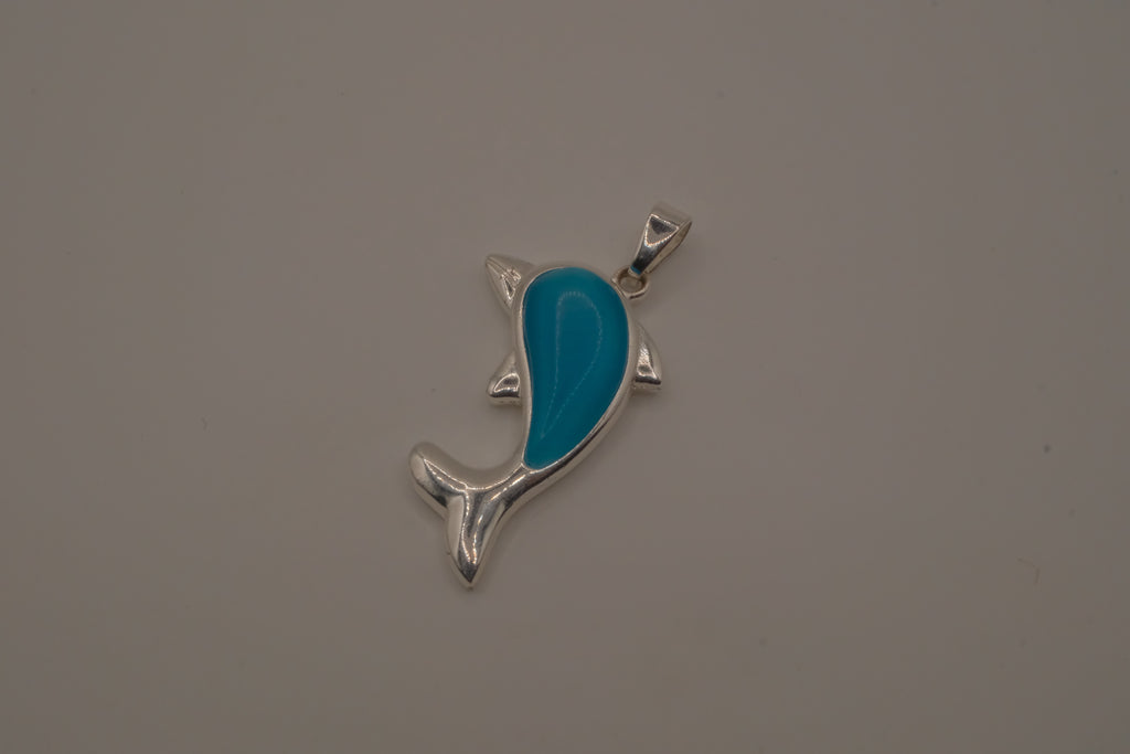 Dolphin pendant inlaid with a blue cabochon