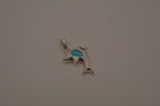 Dolphin pendant inlaid with vibrant blue stone