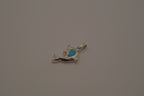 Dolphin pendant inlaid with vibrant blue stone