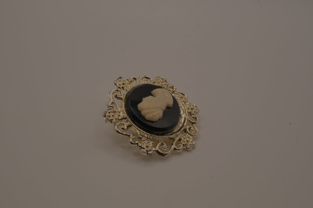 Vintage black and white cameo brooch