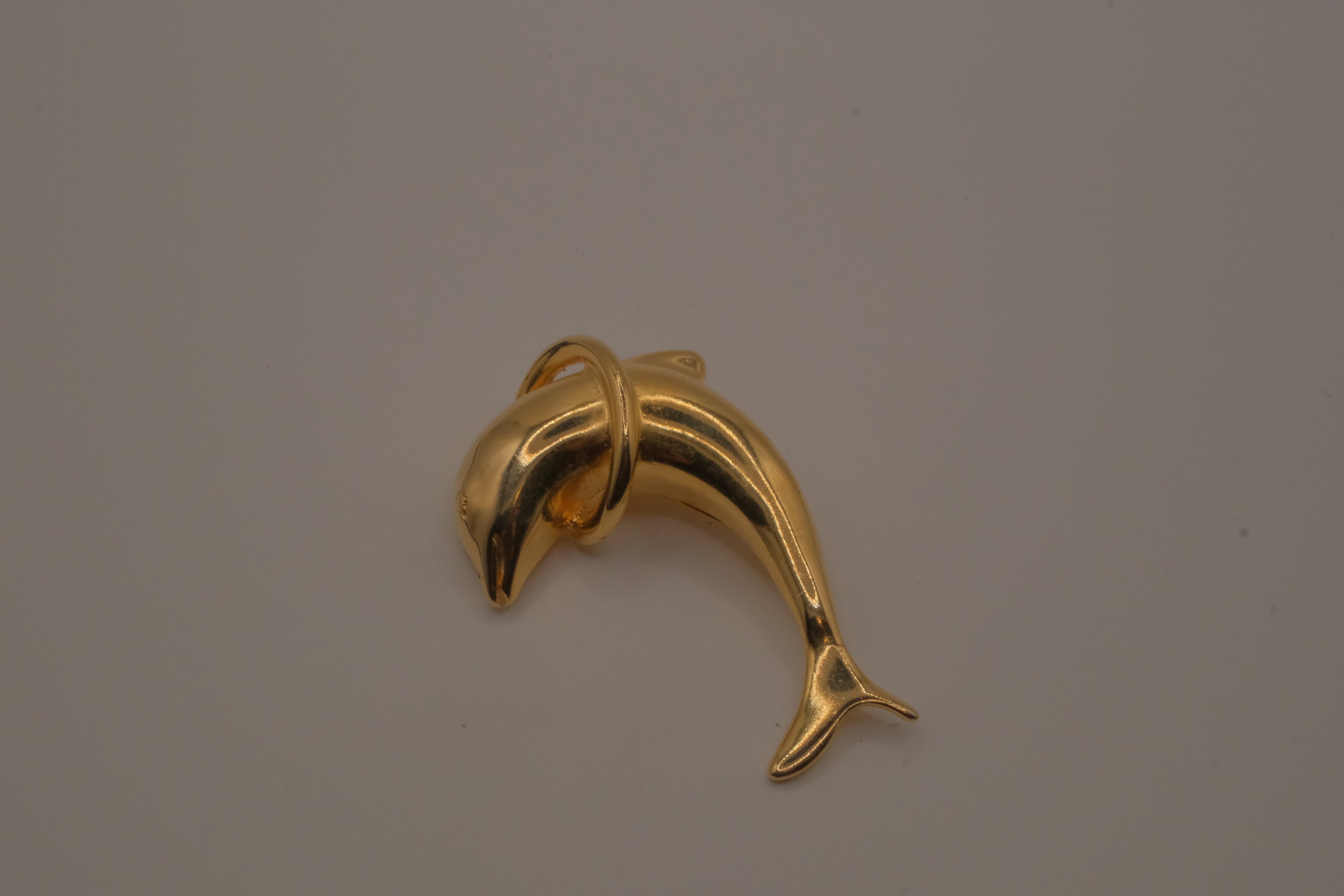 Vintage dolphin jumping through a hoop brooch pin
