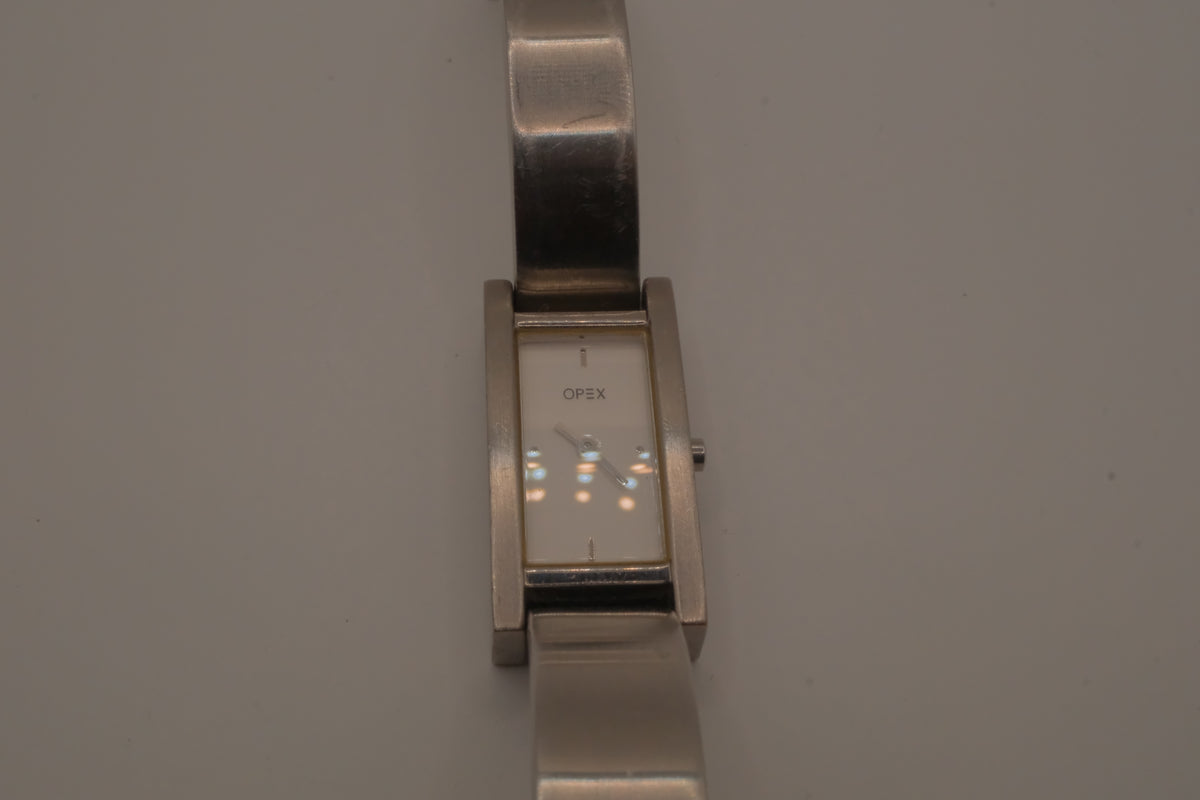 OPEX Paris minimalist rectangular stainless steel bangle watch