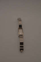 OPEX Paris minimalist rectangular stainless steel bangle watch
