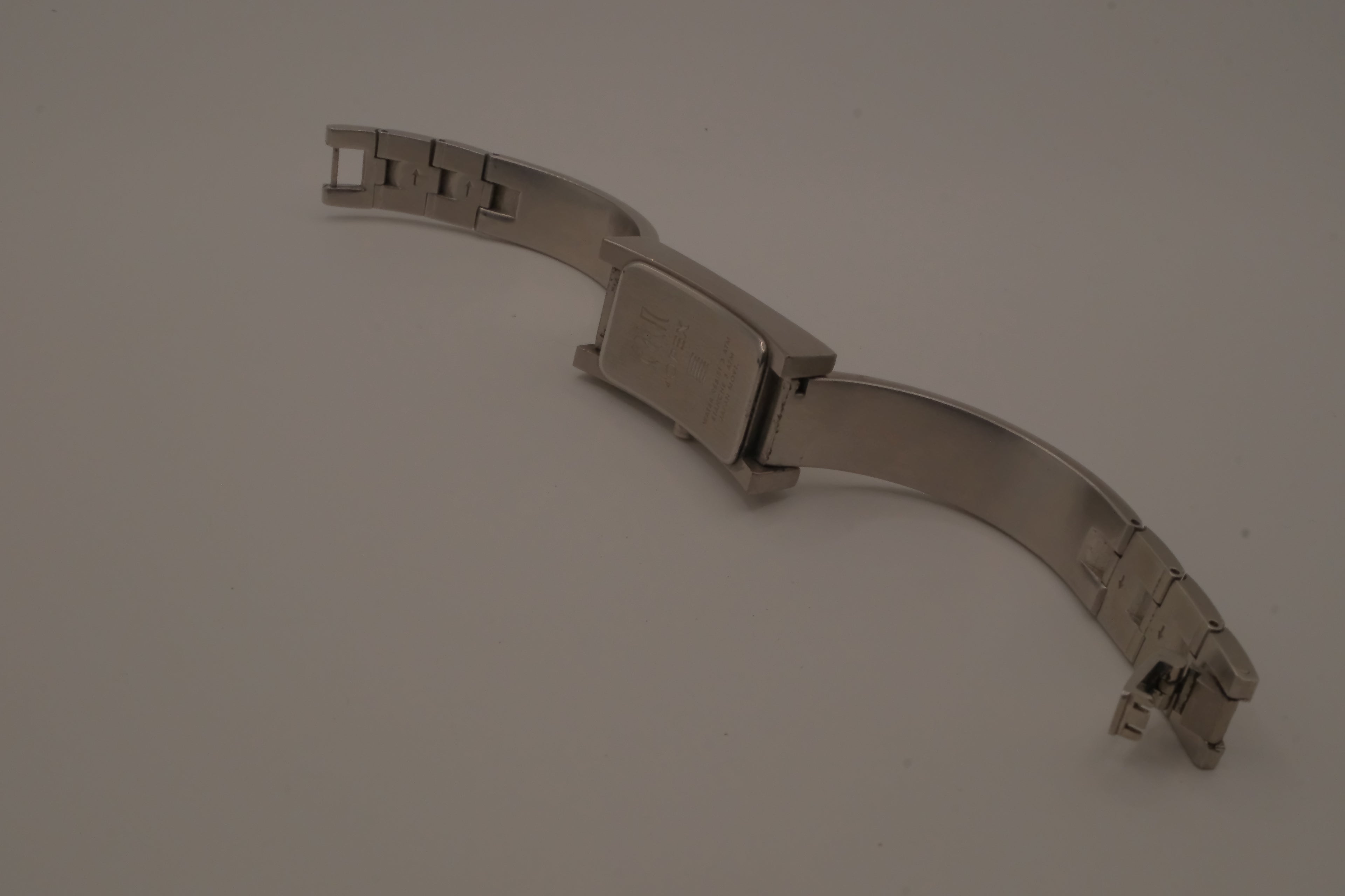 OPEX Paris minimalist rectangular stainless steel bangle watch