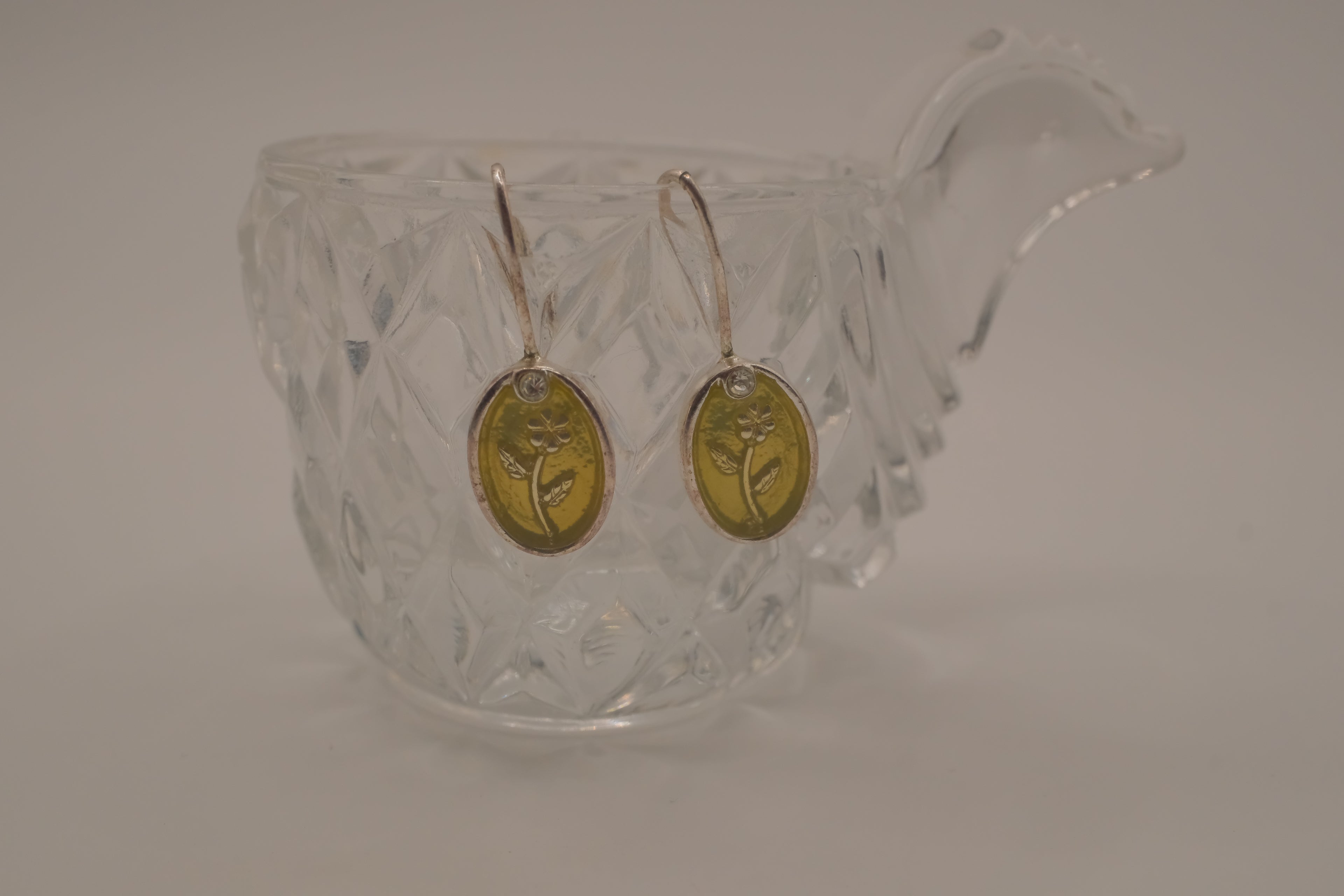 Embossed flower dangle earring