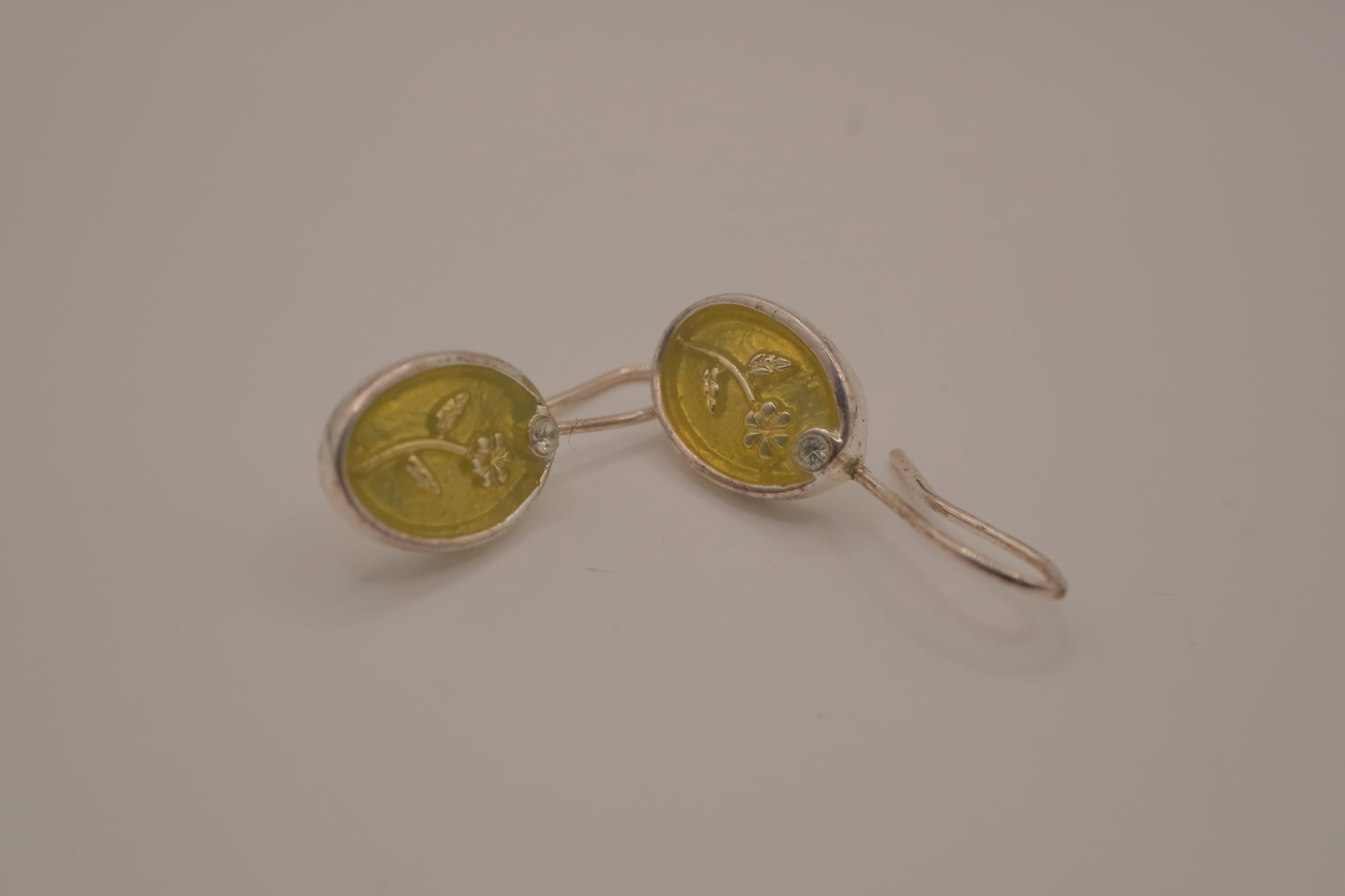 Embossed flower dangle earring