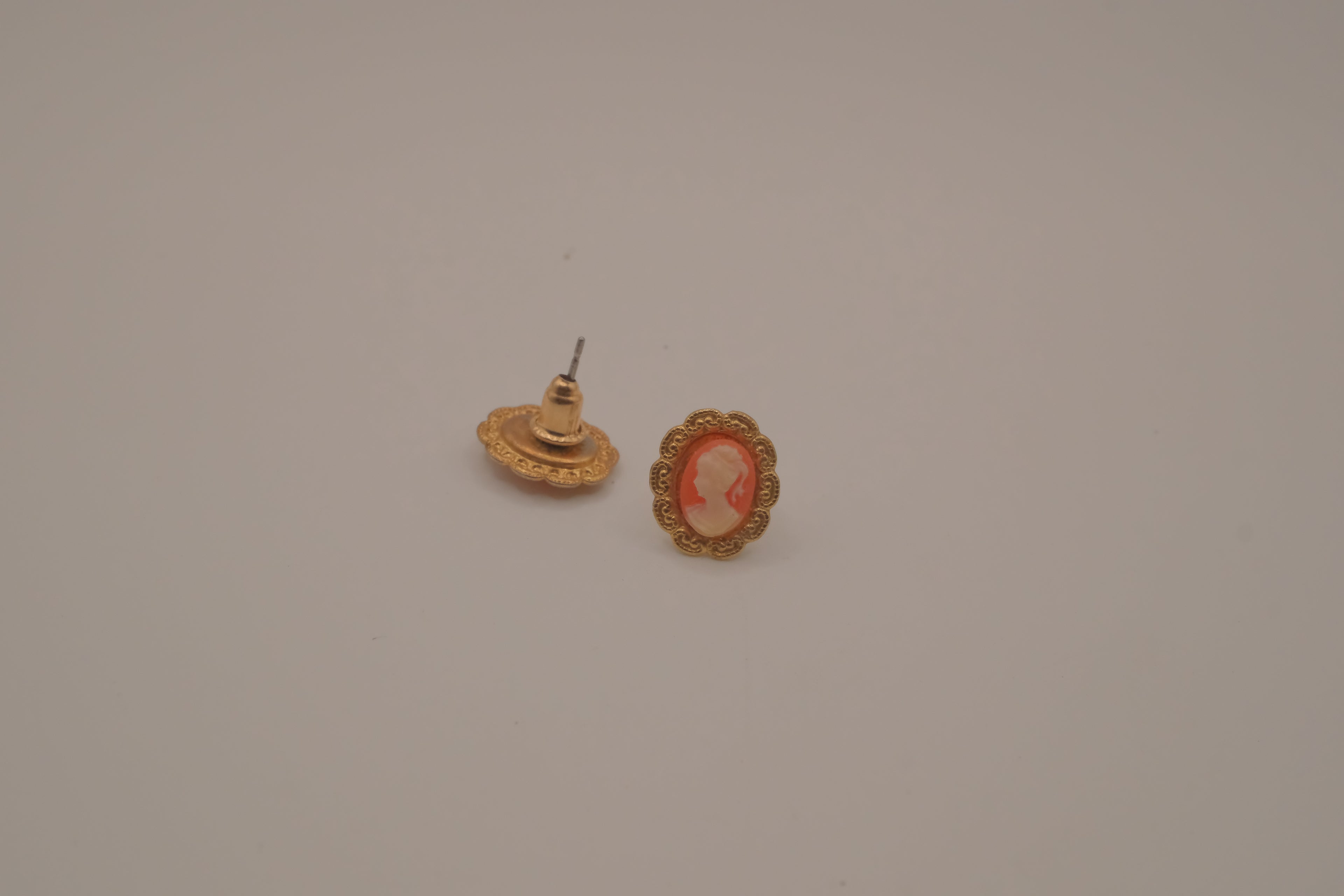 Vintage peach and cream cameo earring