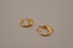 Gold dolphin hoop earring