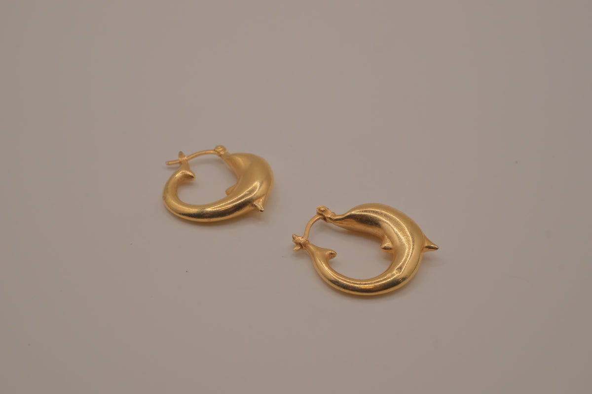 Gold dolphin hoop earring