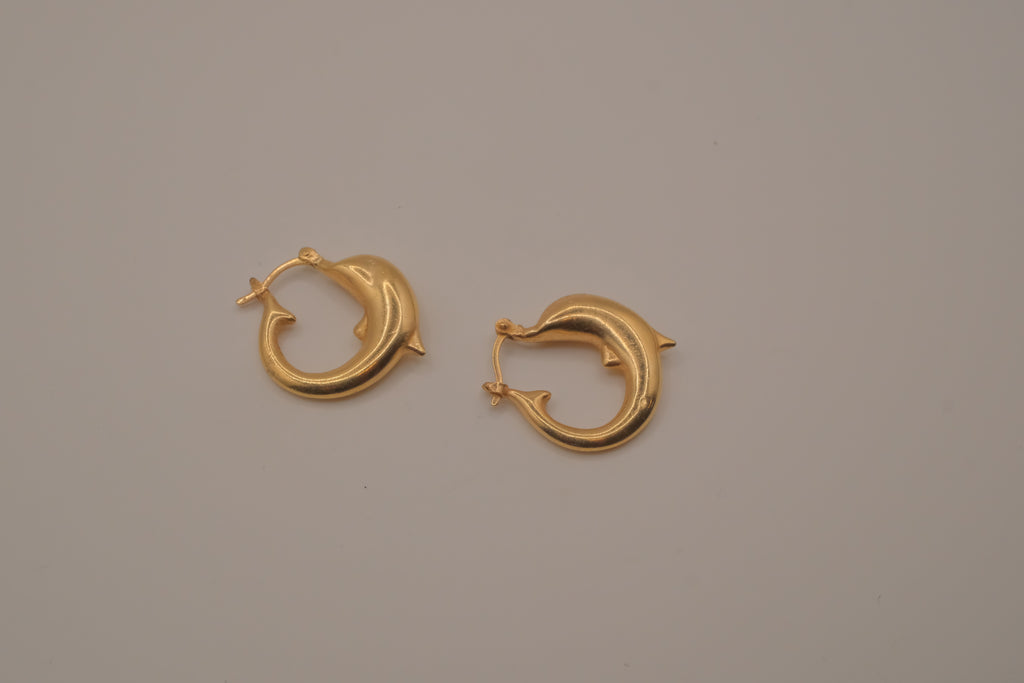 Gold dolphin hoop earring