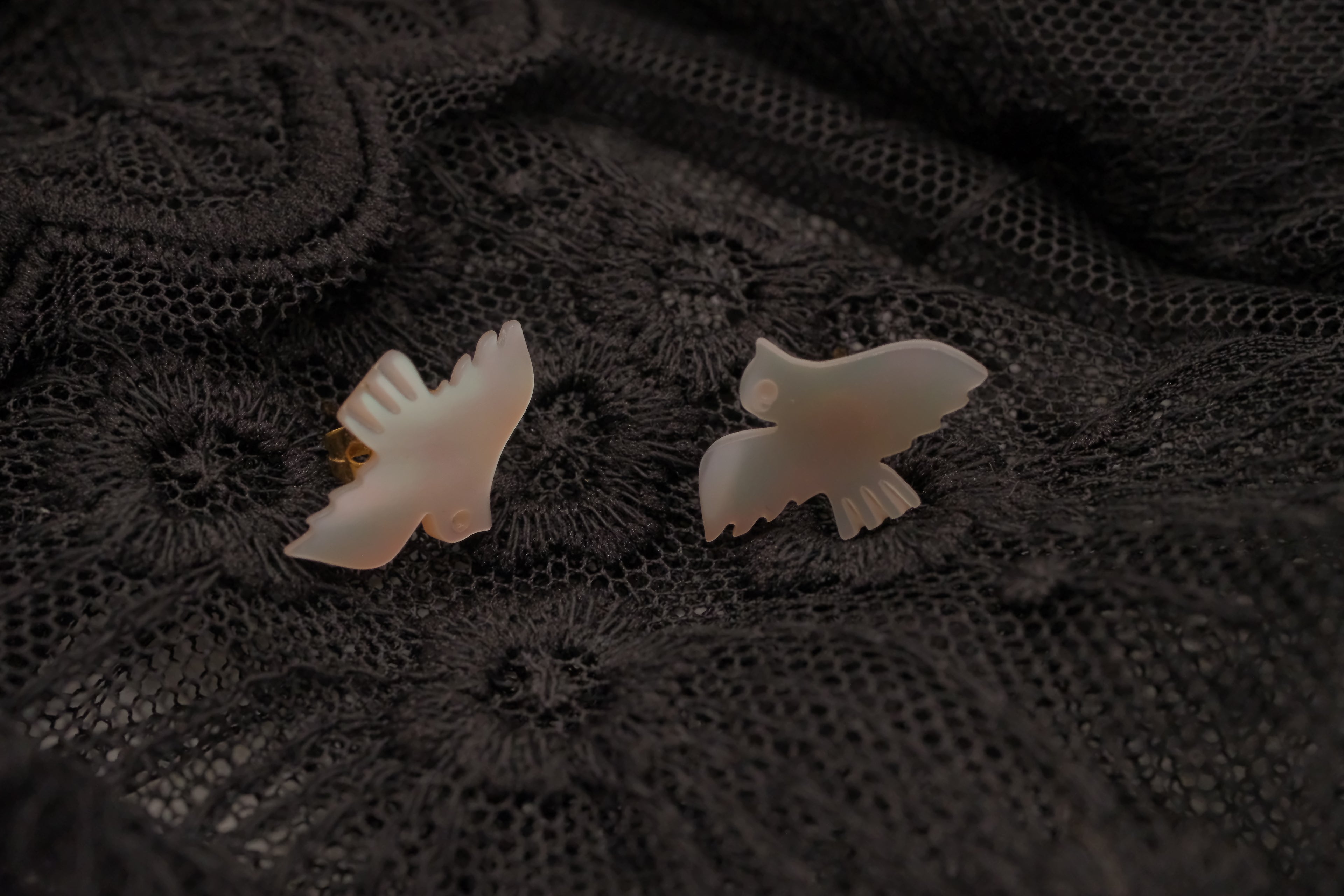 Carved mother-of-pearl dove earring