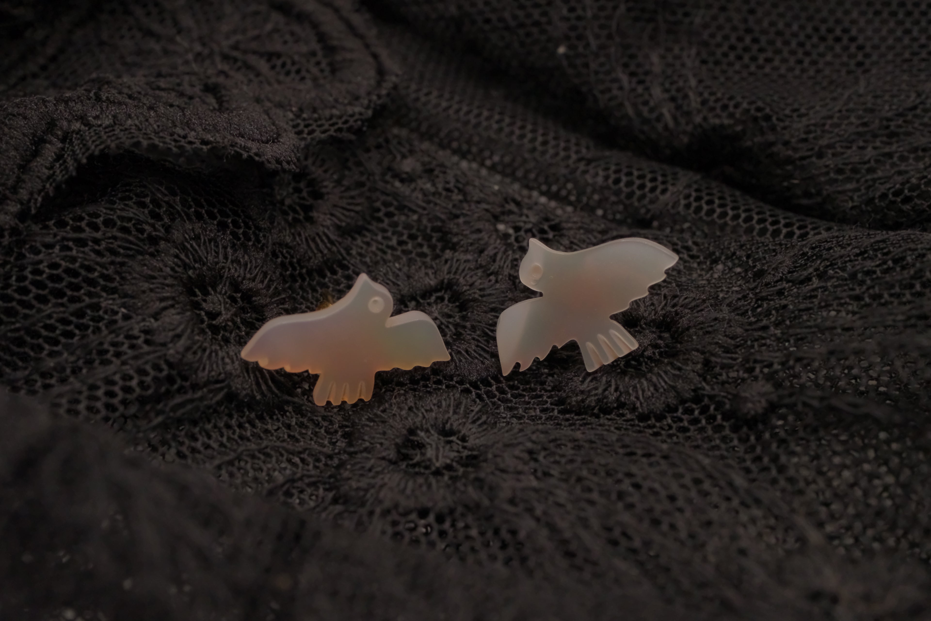 Carved mother-of-pearl dove earring