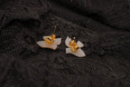 Carved mother-of-pearl dove earring