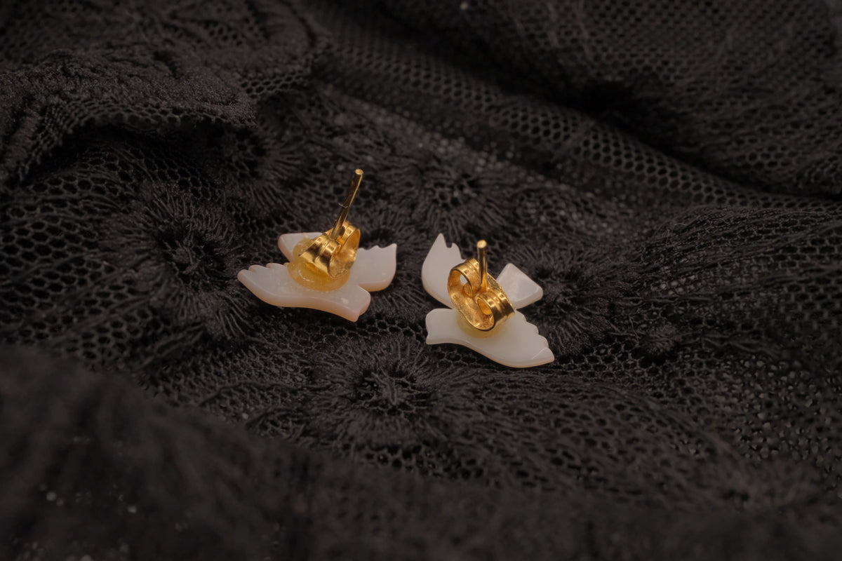 Carved mother-of-pearl dove earring