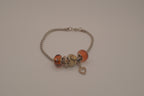 November themed silver snake-chain charm bracelet
