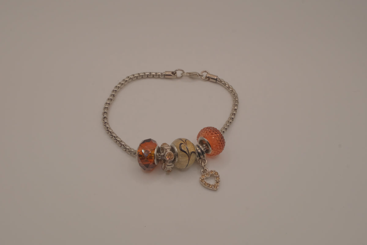 November themed silver snake-chain charm bracelet