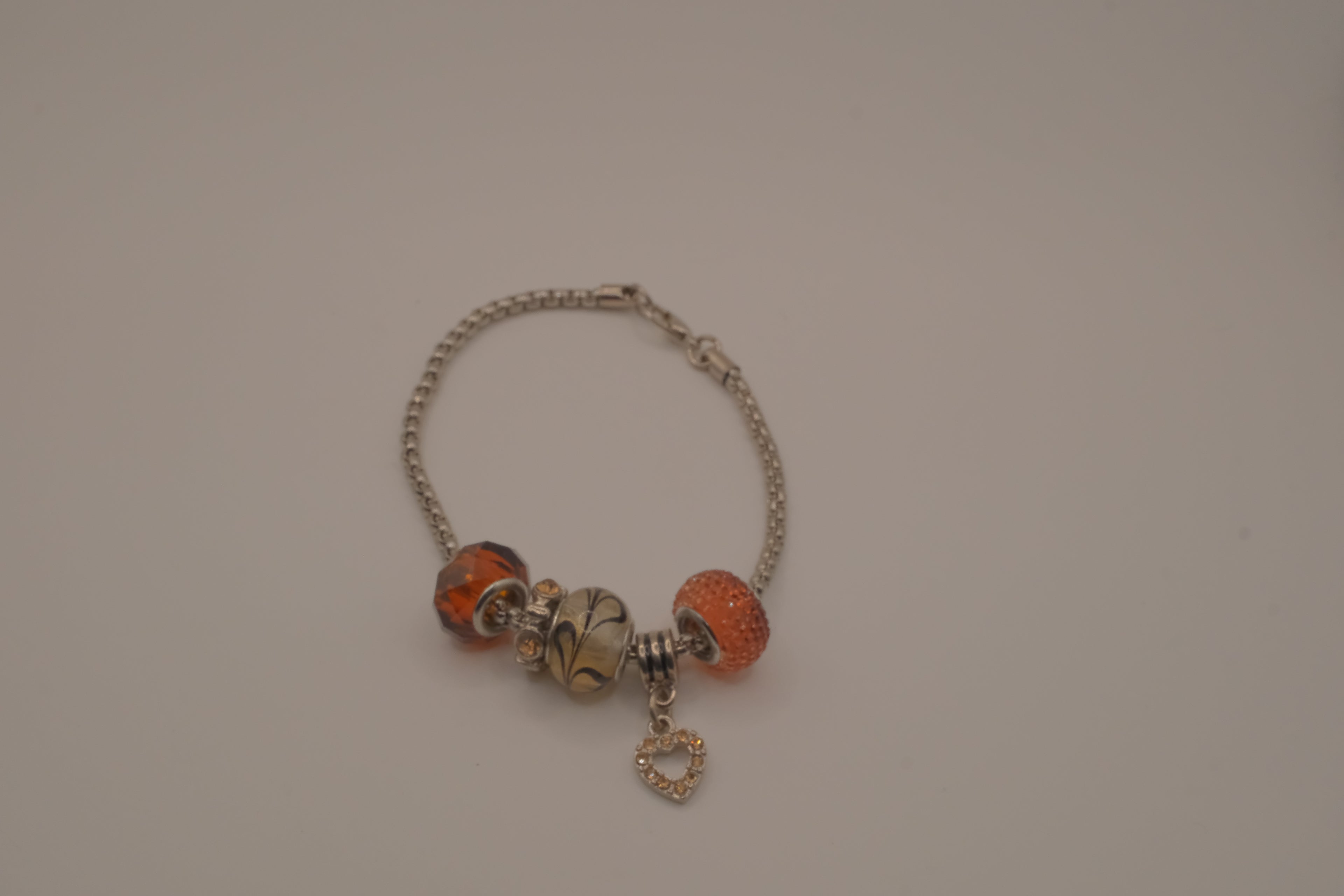 November themed silver snake-chain charm bracelet