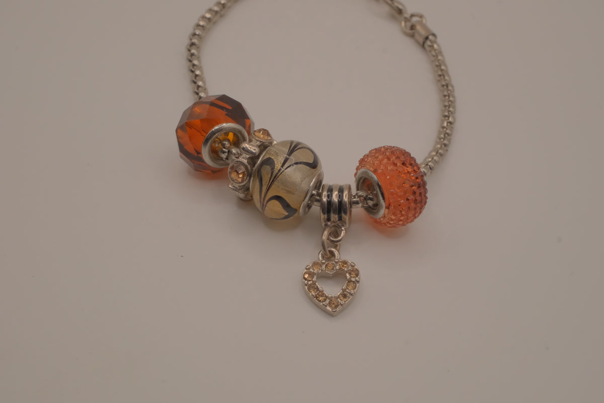 November themed silver snake-chain charm bracelet