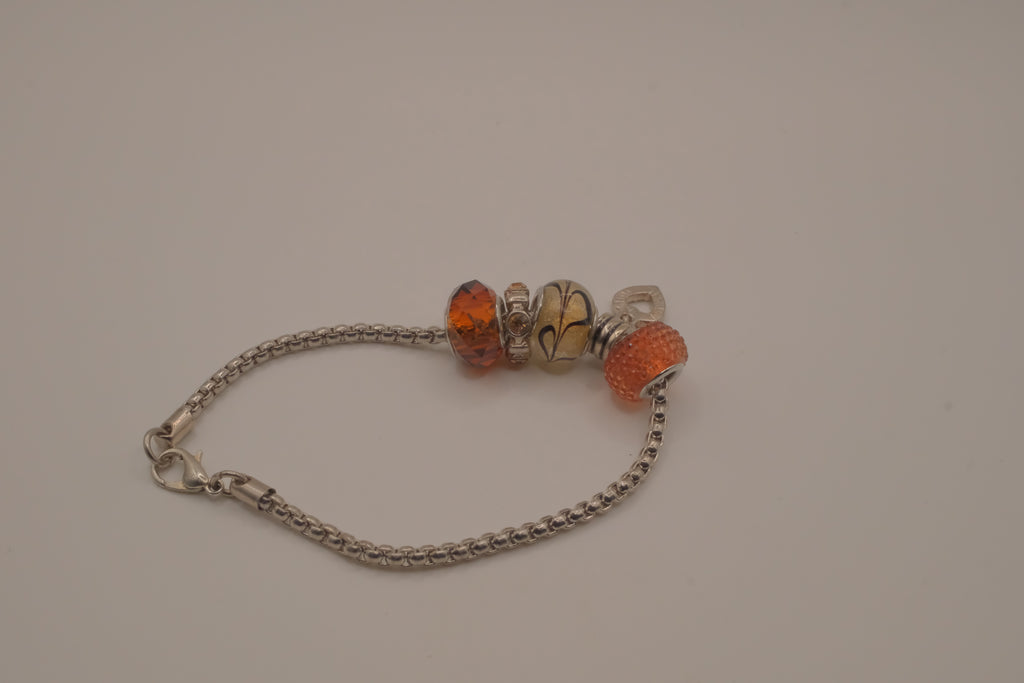 November themed silver snake-chain charm bracelet